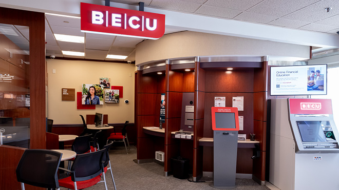 BECU Seattle Roxbury location, a room with a ATMs and a desk